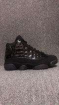 Air Jordan 13 Retro Cap and Gown Sneakers in Black - product image from the listing.