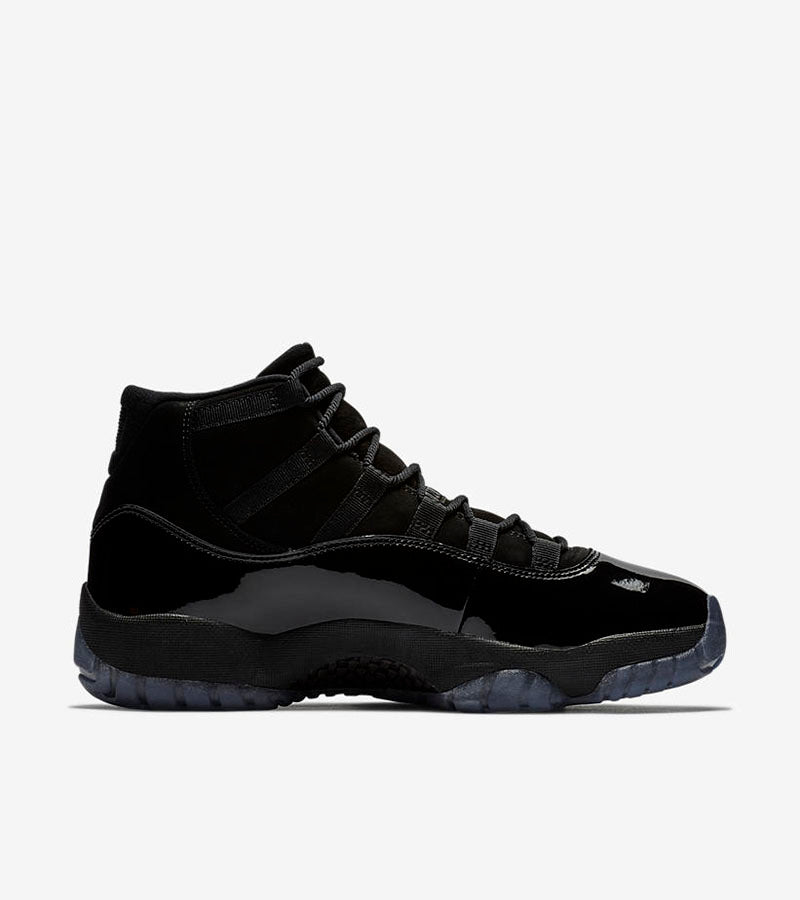 Air Jordan 11 Cap and Gown High-Top Sneakers in Black - product image from the listing.