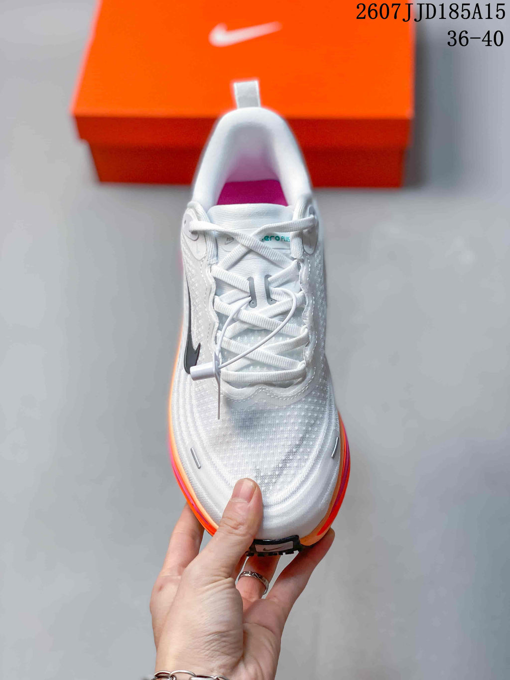 Nike Vomero Plus Running Shoes in White Orange Pink 2607JJD185A15 - product image from the listing.