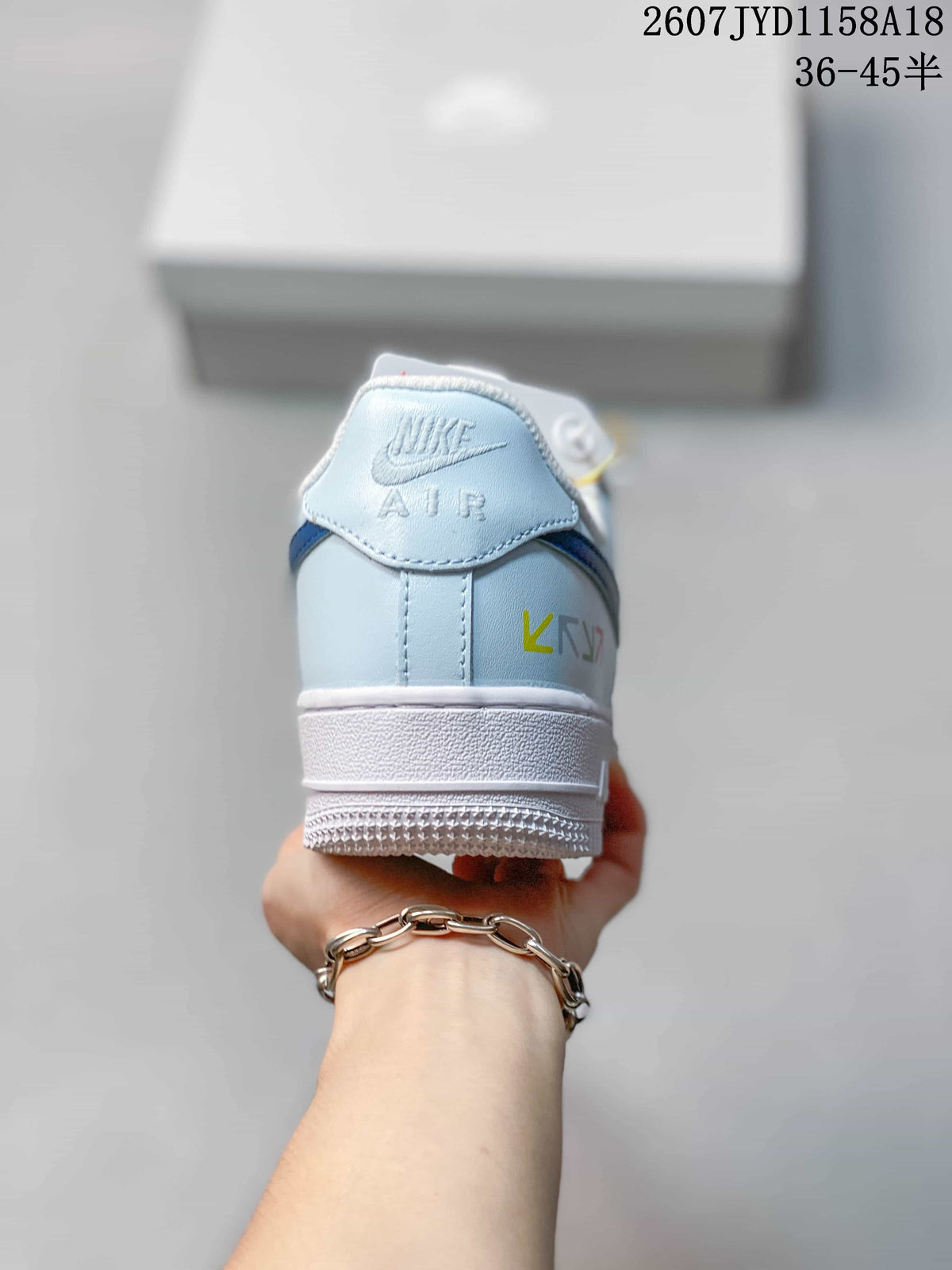Nike Air Force 1 '07 Low Sneakers, in White and Light Blue - product image from the listing.