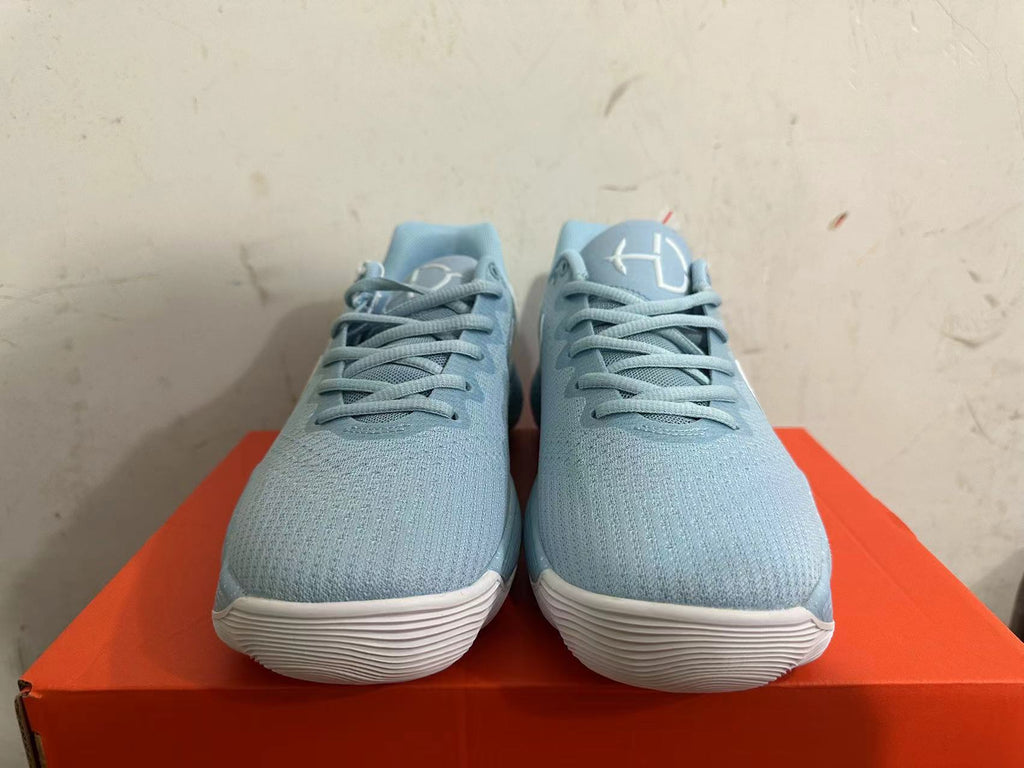 Nike Basketball Footwear in Blue with White Swoosh - product image from the listing.