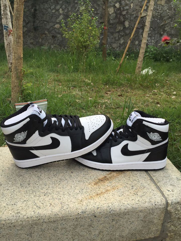Jordan 1 High Sneakers in Black and White - product image from the listing.