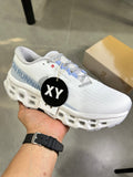 On Running Cloudsurfer Next Running Shoes in White Blue - product image from the listing.