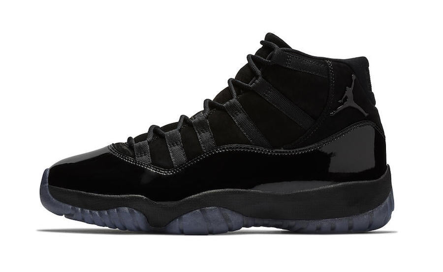 Air Jordan 11 Cap and Gown High-Top Sneakers in Black - product image from the listing.