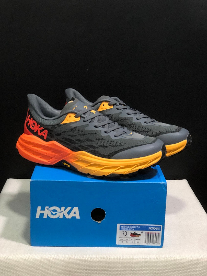 HOKA Speedgoat 5 Trail Running Shoes, in Gray and Orange - product image from the listing.