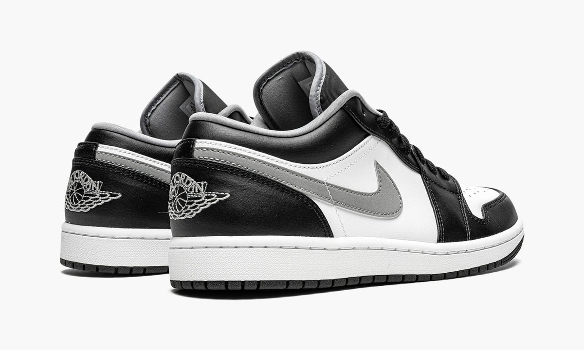 Air Jordan 1 Low Black / Particle in Grey - product image from the listing.