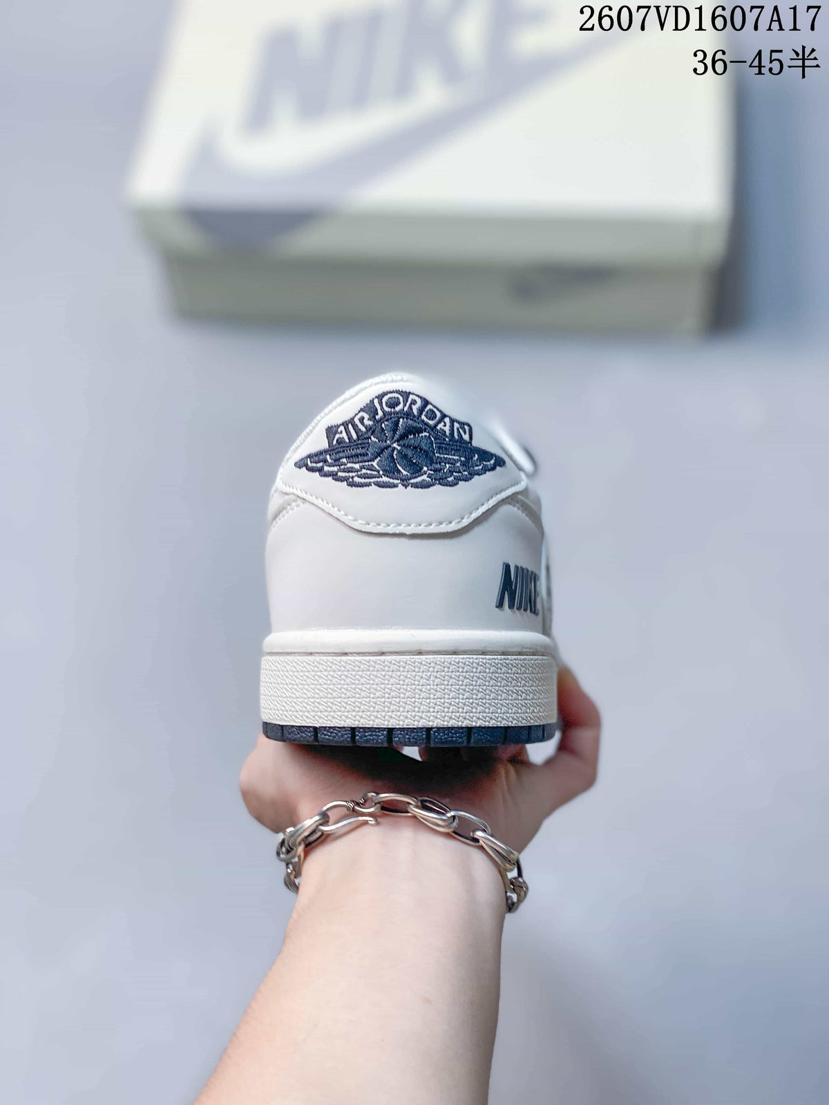 Travis Scott x Jordan 1 Low Sneakers in White Black 2607VD1607A17 - product image from the listing.