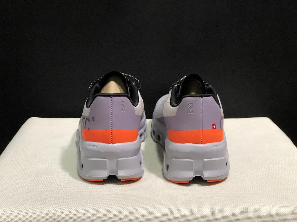 On Cloudmonster Sneakers in Foggy in White and Orange - product image from the listing.