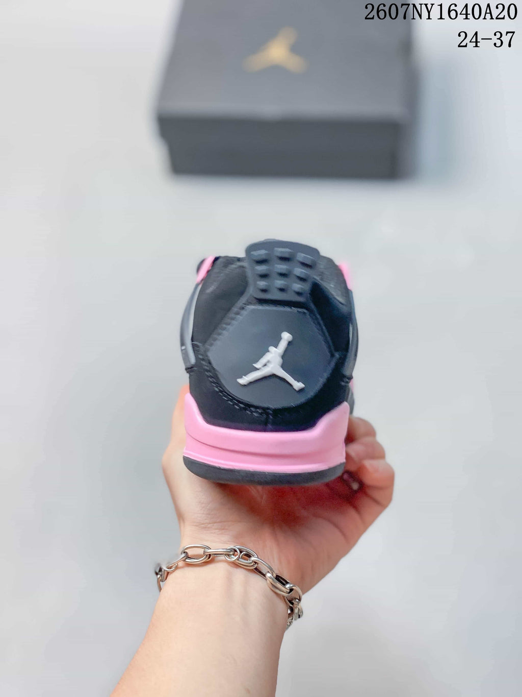 Jordan Panda Low-Top Kids Basketball Sneakers in Black Pink - product image from the listing.