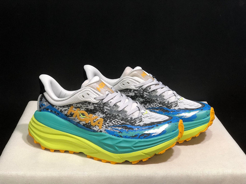 Blue and Lime HOKA Stinson 7 Trail Sneakers - product image from the listing.