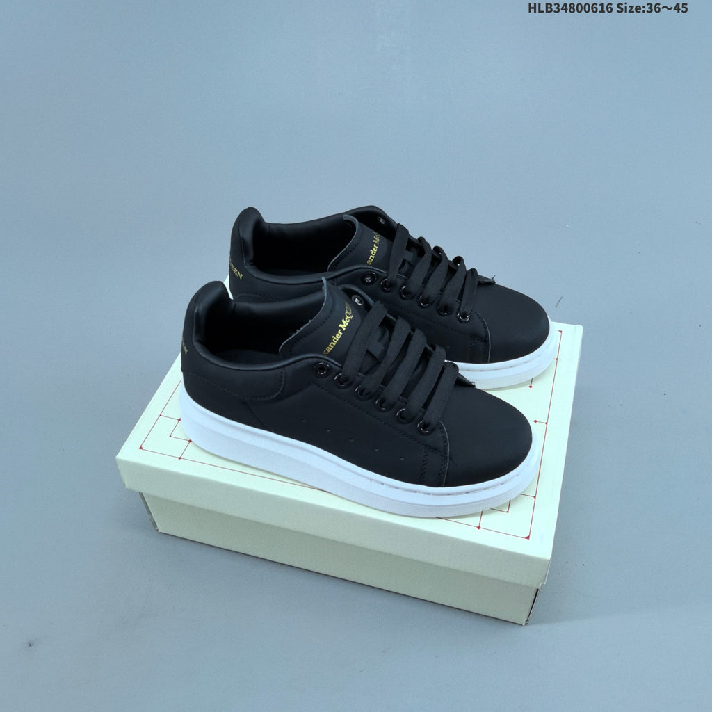 Alexander McQueen Oversized Low-Top Sneakers, in White and Black - product image from the listing.