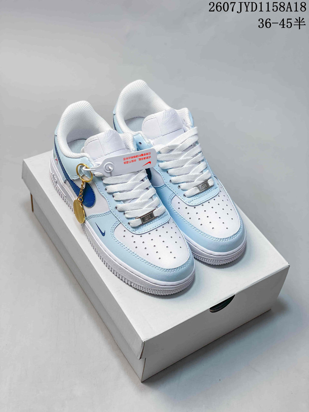 Nike Air Force 1 '07 Low Sneakers, in White and Light Blue - product image from the listing.