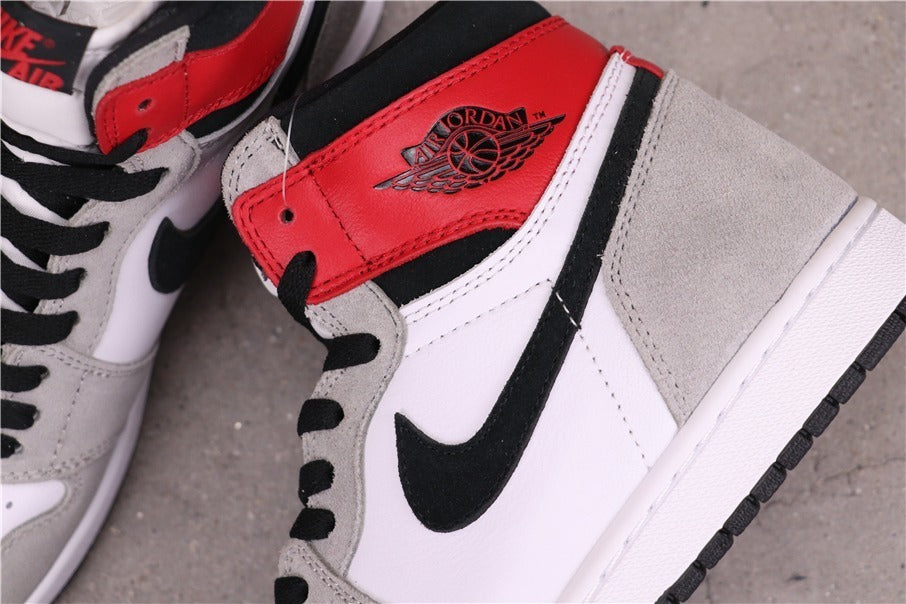 Air Jordan 1 High Sneakers in Light Smoke Grey 555088-126 - product image from the listing.