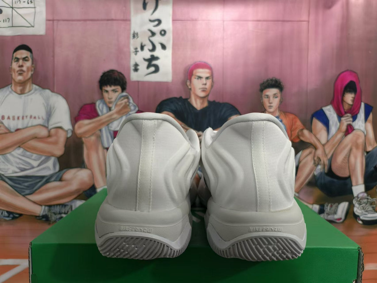 Nike White Basketball Trainers with Black Swoosh - product image from the listing.
