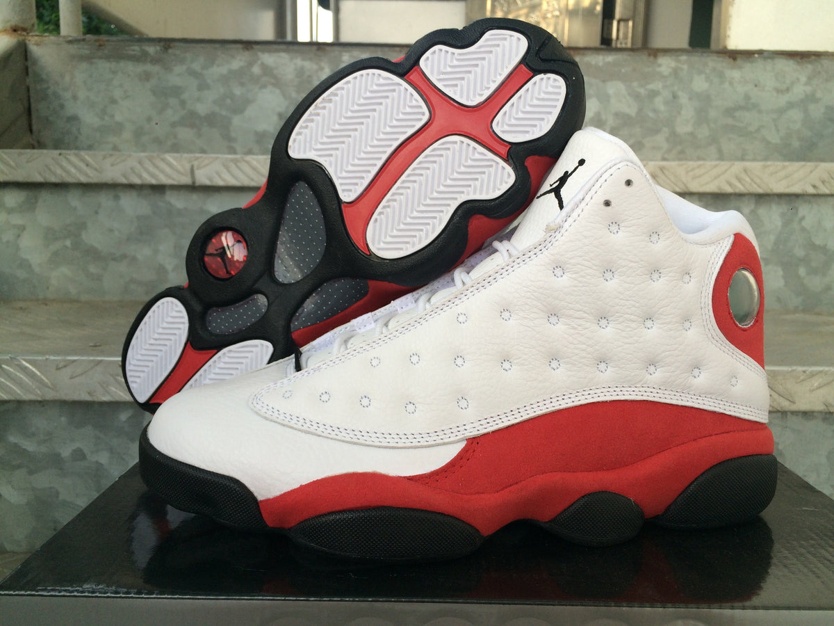 Air Jordan 13 Sneakers in White Red Black - product image from the listing.