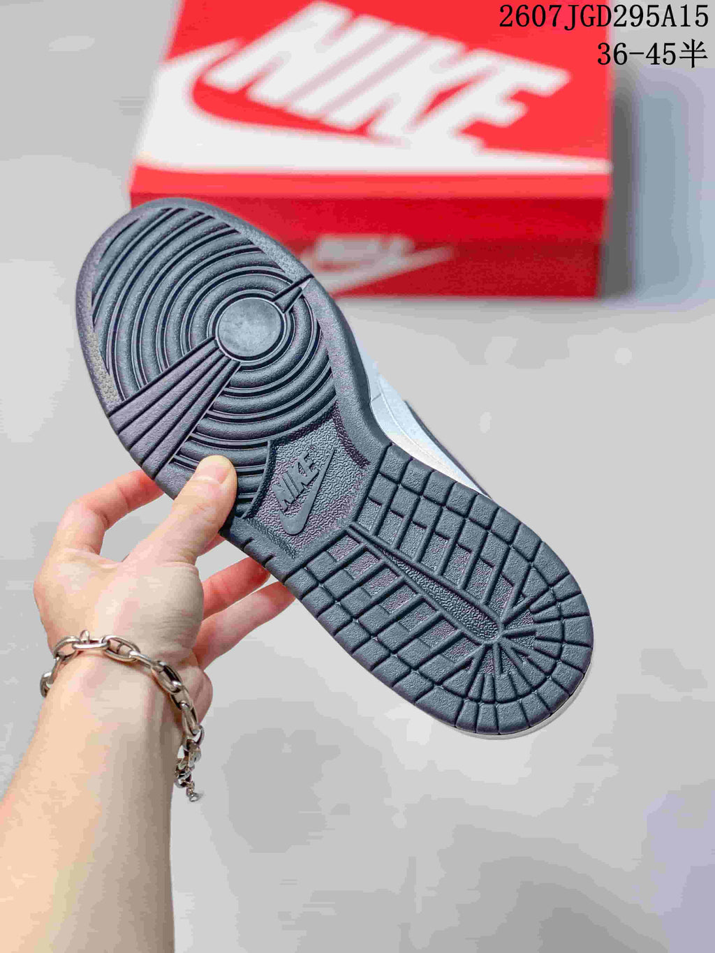 Nike SB Dunk Low Pro Sneakers in White Black 2607TGD295A15 - product image from the listing.