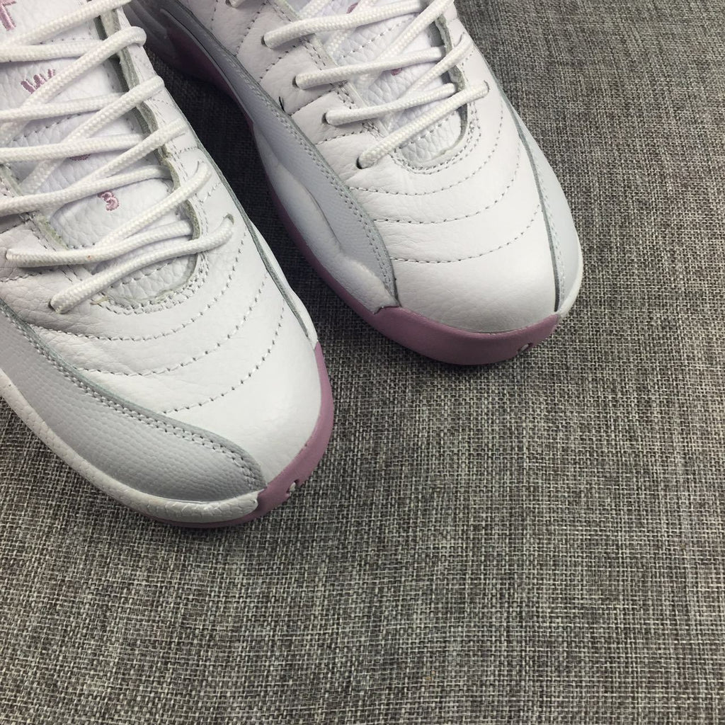 Air Jordan 12 Cherry Blossom Pink Sneakers - product image from the listing.