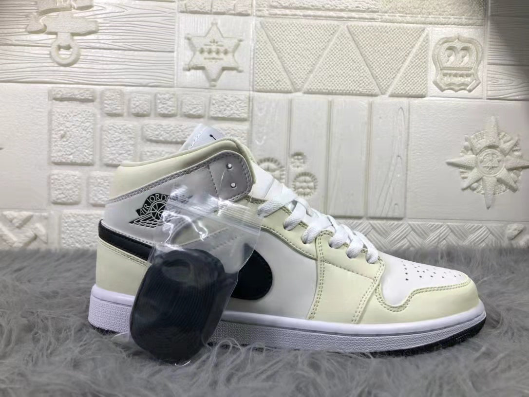 Jordan Air 1 Mid Sneakers in Cream White and Black - product image from the listing.