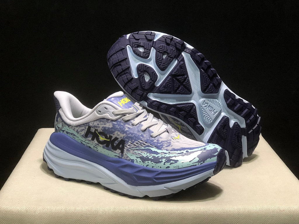 Purple and Mint HOKA Stinson 7 Running Shoes - product image from the listing.