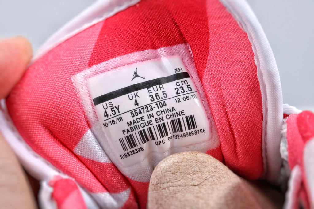 Women's Nike Air Jordan 1 Low White and Pink Sneakers - product image from the listing.