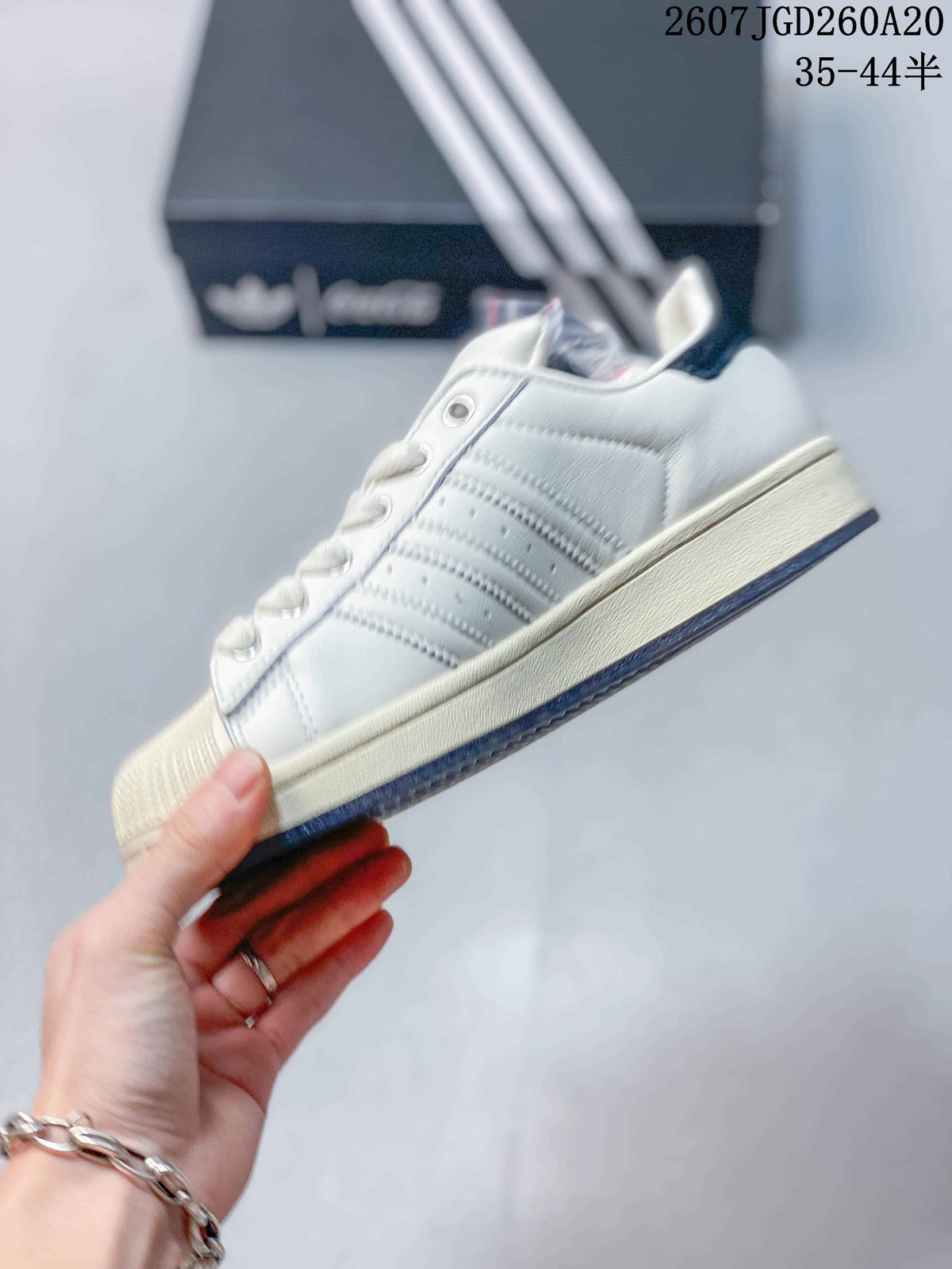 Adidas Superstar x Coca-Cola Low-Top Sneakers in White KH6892 - product image from the listing.