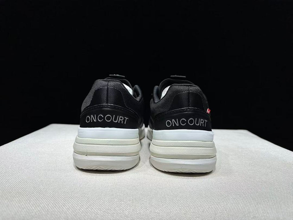 On THE ROGER Clubhouse Pro Tennis Sneakers in Black and White - product image from the listing.