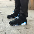 Air Jordan 6 UNC Black and University Blue Sneakers - product image from the listing.