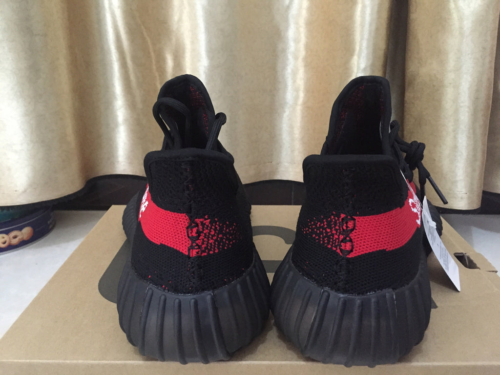 Yeezy 350 V2 Sneakers in Black and Red Knit - product image from the listing.