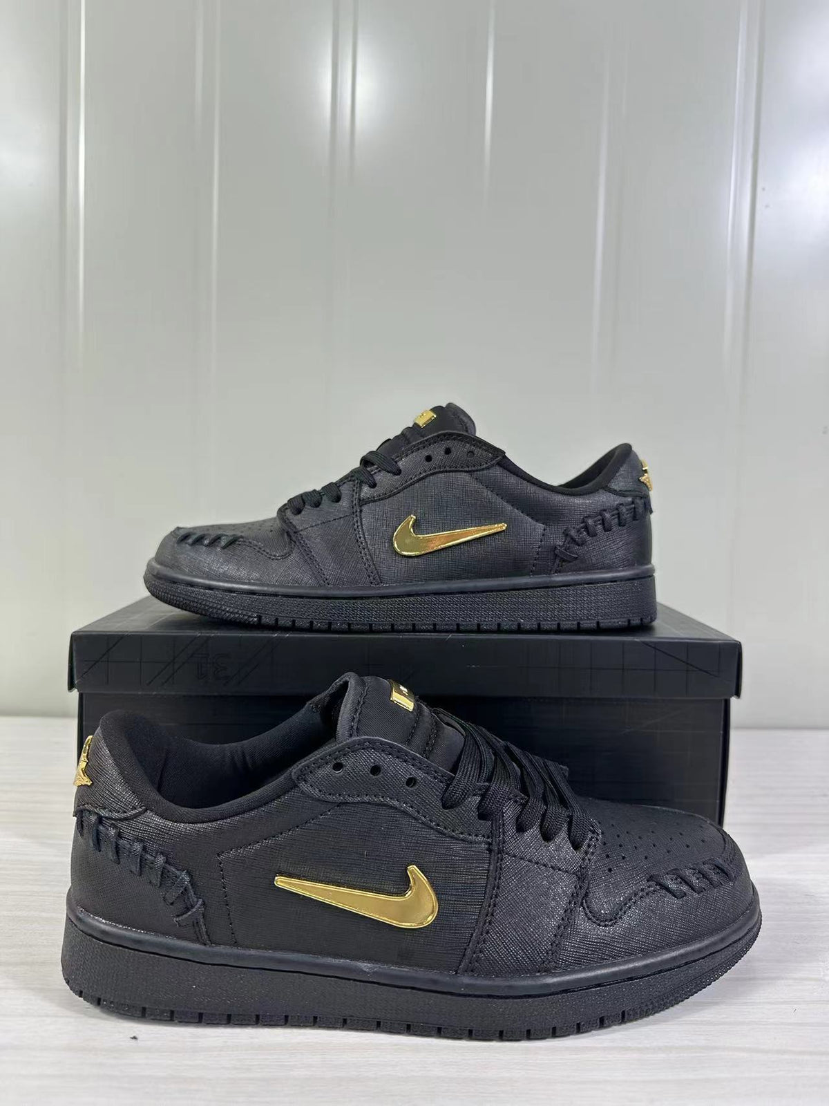 Air Jordan 1 Low Sneakers Black/Gold FN5032-007 - product image from the listing.
