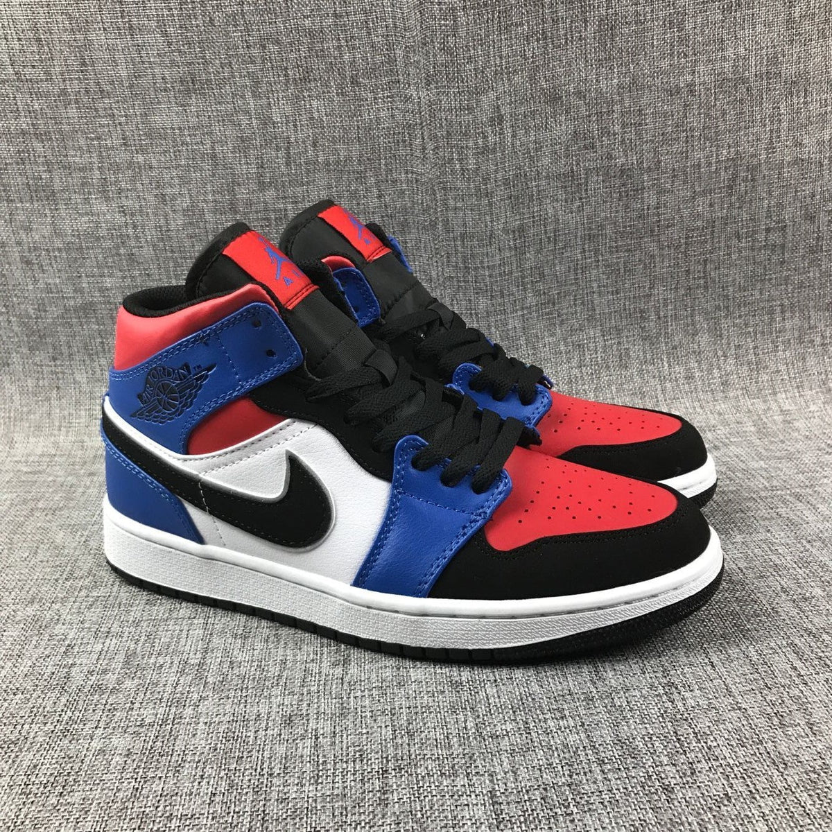 Air Jordan 1 Mid Sneakers in Blue Red Black White - product image from the listing.