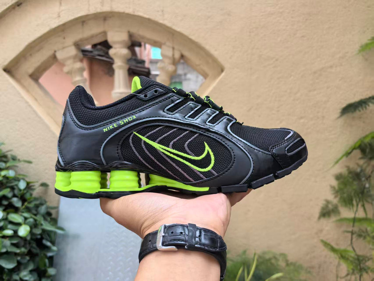 Nike Shox Sneakers in Black and Volt Green - product image from the listing.