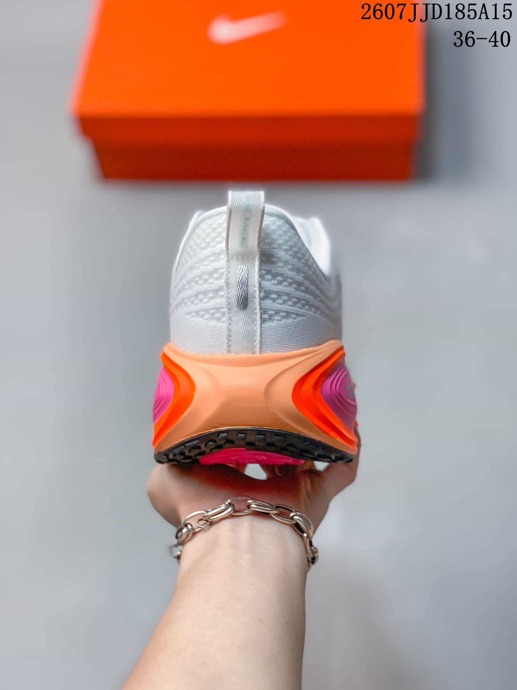 Nike Vomero Plus Running Shoes in White Orange Pink 2607JJD185A15 - product image from the listing.