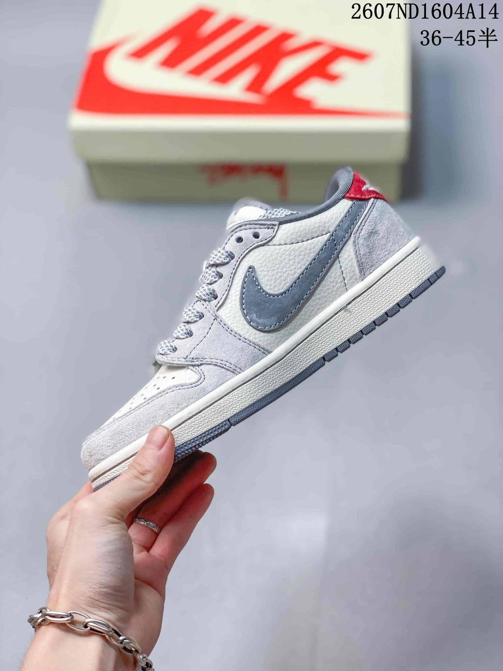 Nike SB Dunk Low Sneakers in Gray and Off-White 2607ND1604A14 - product image from the listing.
