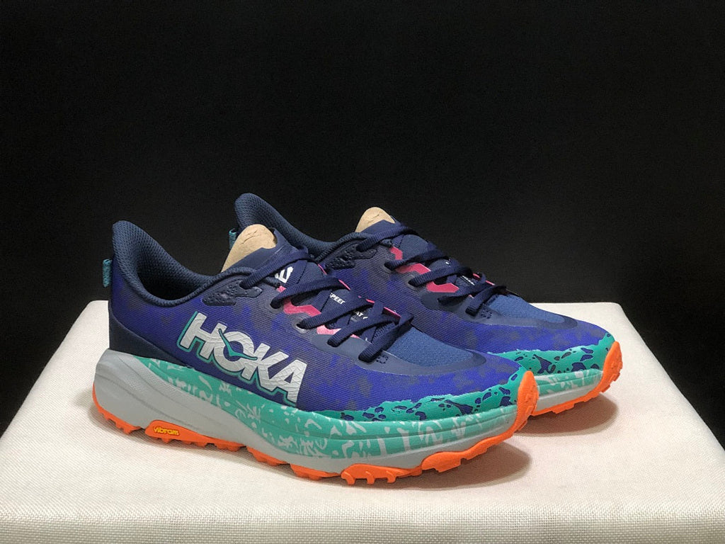 HOKA Speedgoat 6 Trail Running Shoes, in Blue and Teal - product image from the listing.