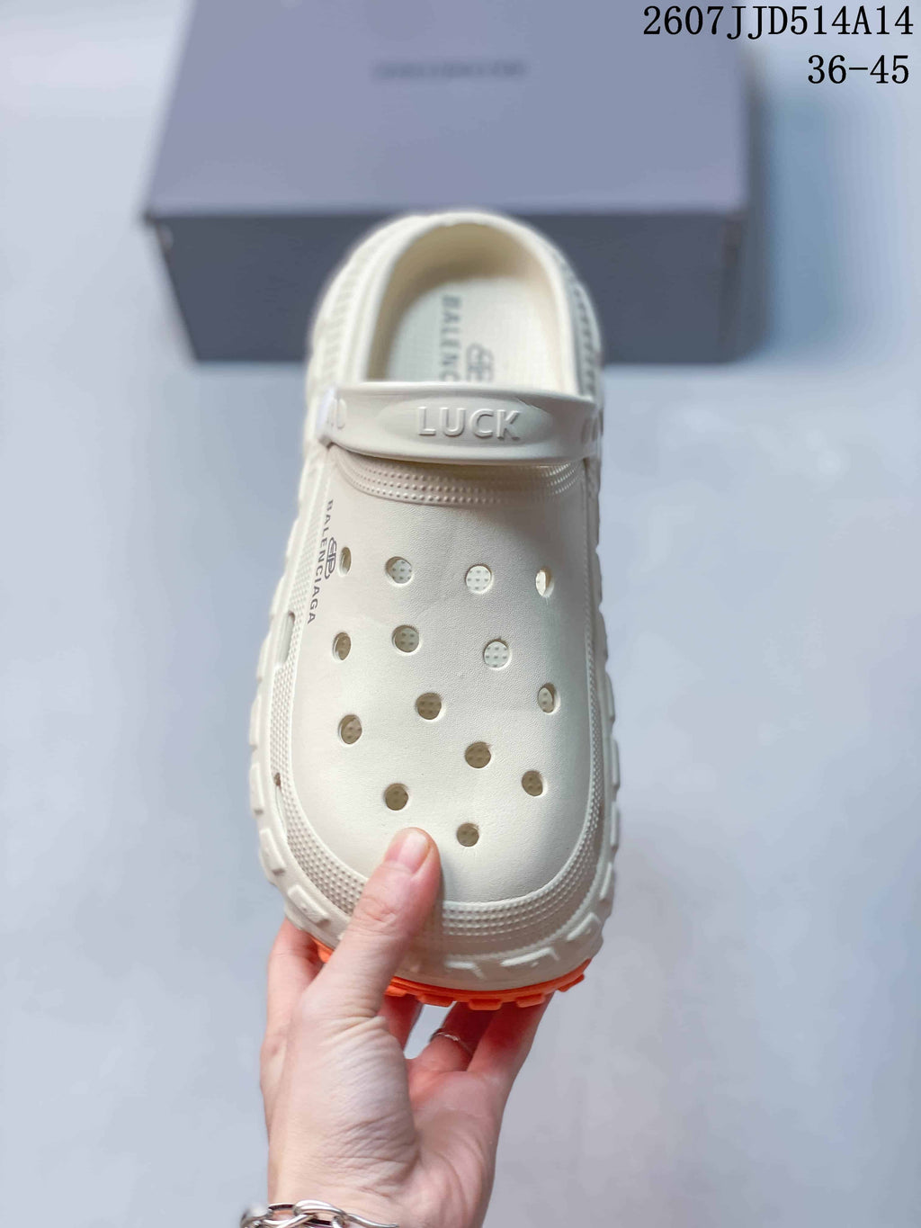 Balenciaga Tire Clog Sandals Off-White in Orange 2607JJD514A14 - product image from the listing.