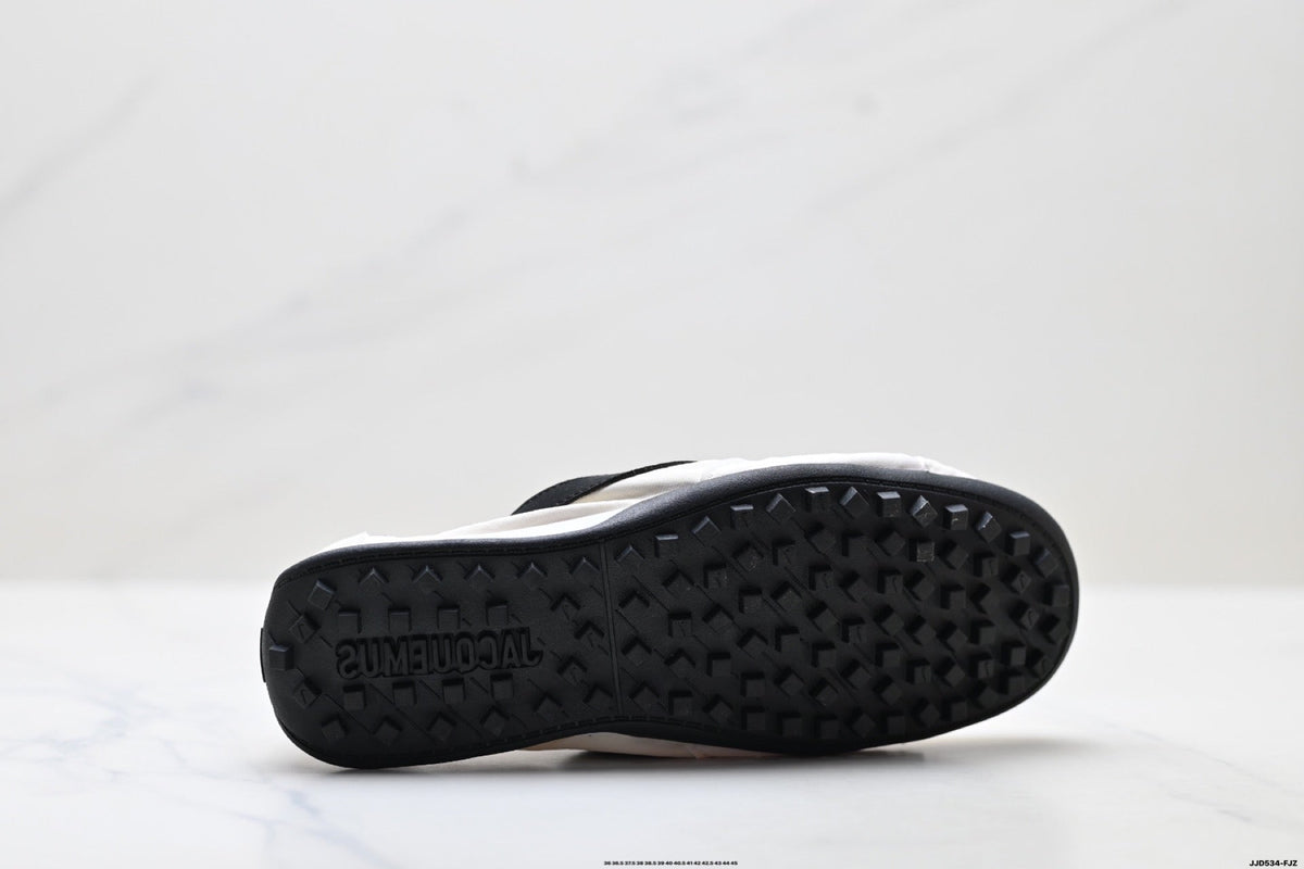 Jacquemus x Nike Jacumoon Low-Top Sneakers, in White and Black - product image from the listing.