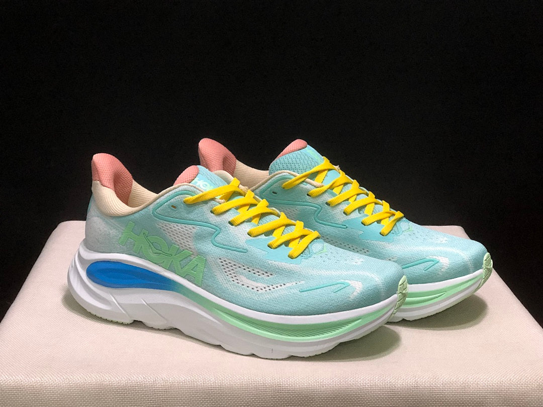 Aqua and Yellow HOKA Clifton 10 Running Shoes - product image from the listing.