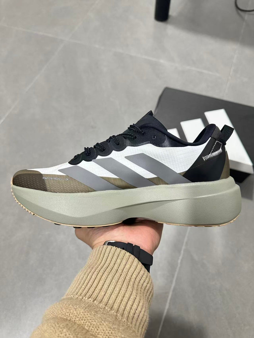 Black and White Adidas Adizero SL Running Shoes - product image from the listing.