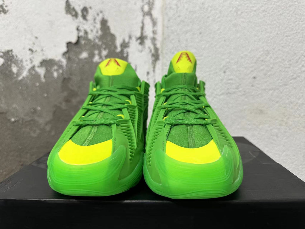 Adidas Green Basketball Trainers with Yellow Accents - product image from the listing.