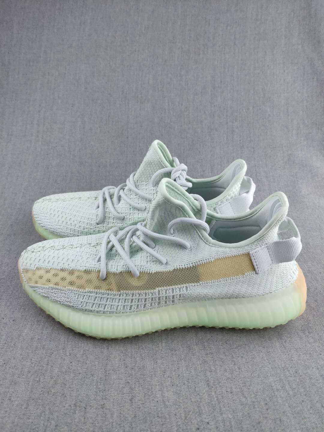 White and Tan Yeezy 350 V2 Knit Sneakers - product image from the listing.