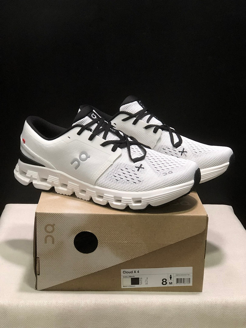 On Cloud X 4 Sneakers in Ivory and Black - product image from the listing.