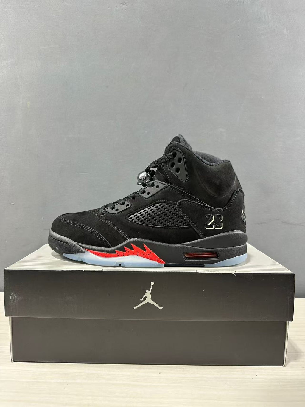Air Jordan 5 Retro Sneakers Black and Red - product image from the listing.
