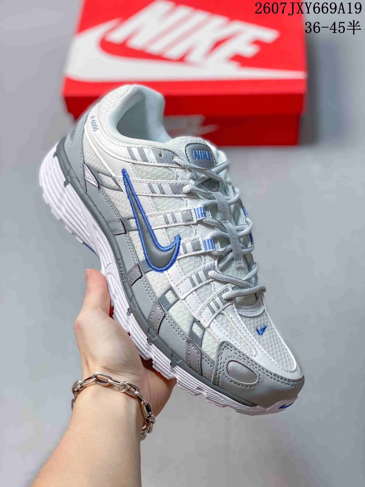 Nike P-6000 Retro Running Sneakers in White Grey Blue - product image from the listing.