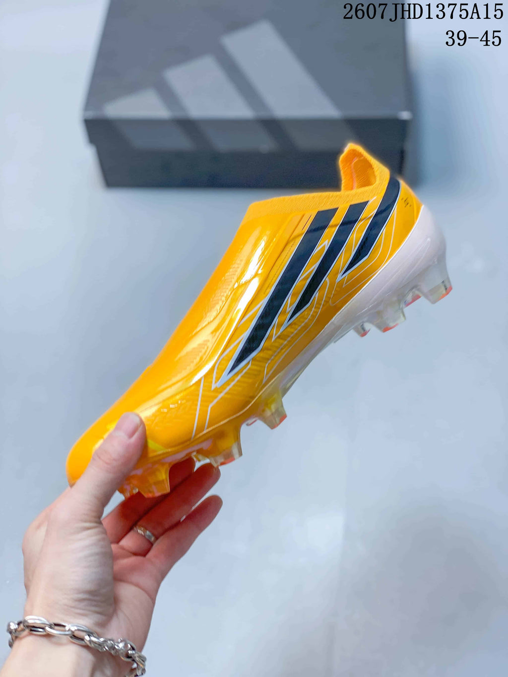 F50 Elite Yellow Black Laceless Soccer Cleats by adidas - product image from the listing.