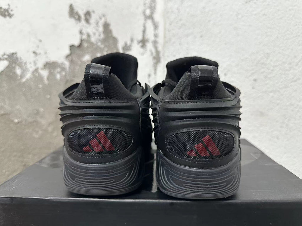 Adidas Black Trainers with Sculpted Side Panels - product image from the listing.