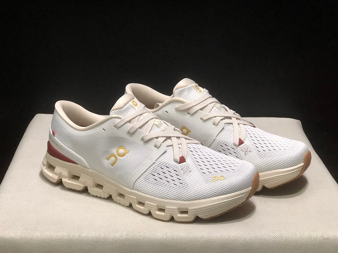 On Cloud X 4 Year of the Snake Sneakers in Ivory Cream - product image from the listing.