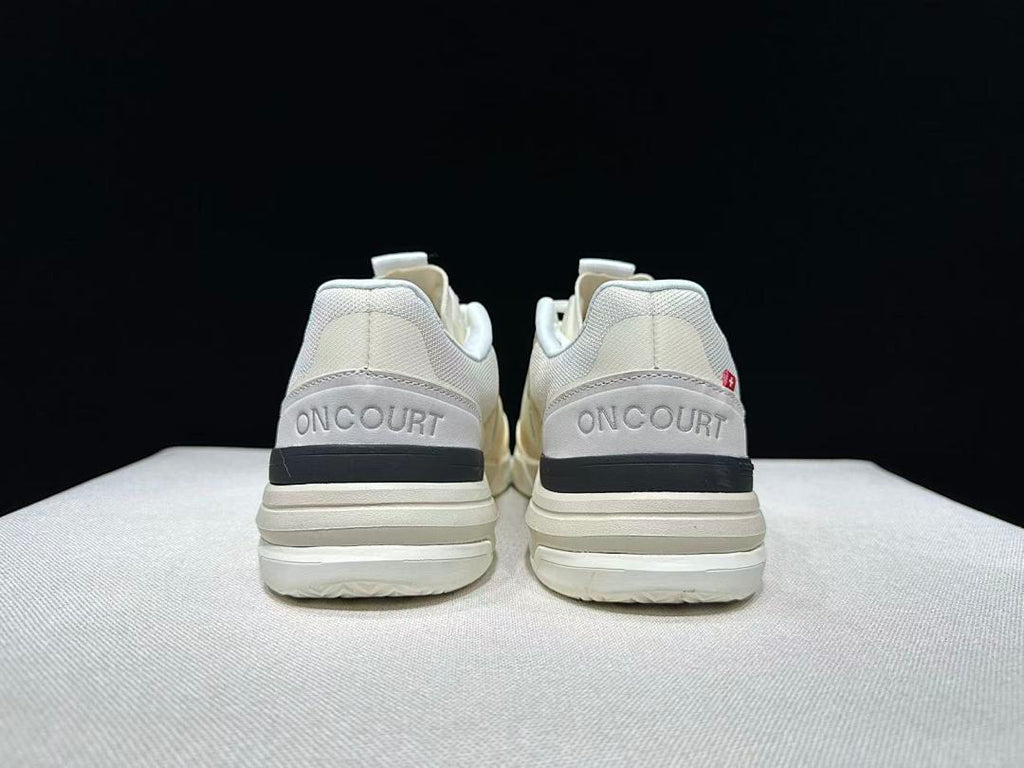 Cream and Black On The Roger Advantage Pro Sneakers - product image from the listing.