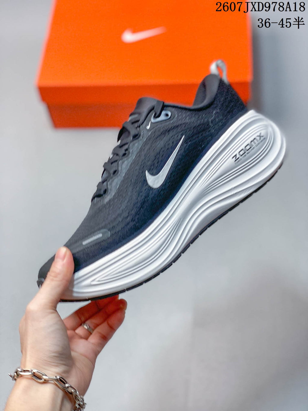Nike Vomero Plus Running Sneakers in Dark Gray White 2607JXD978A18 - product image from the listing.