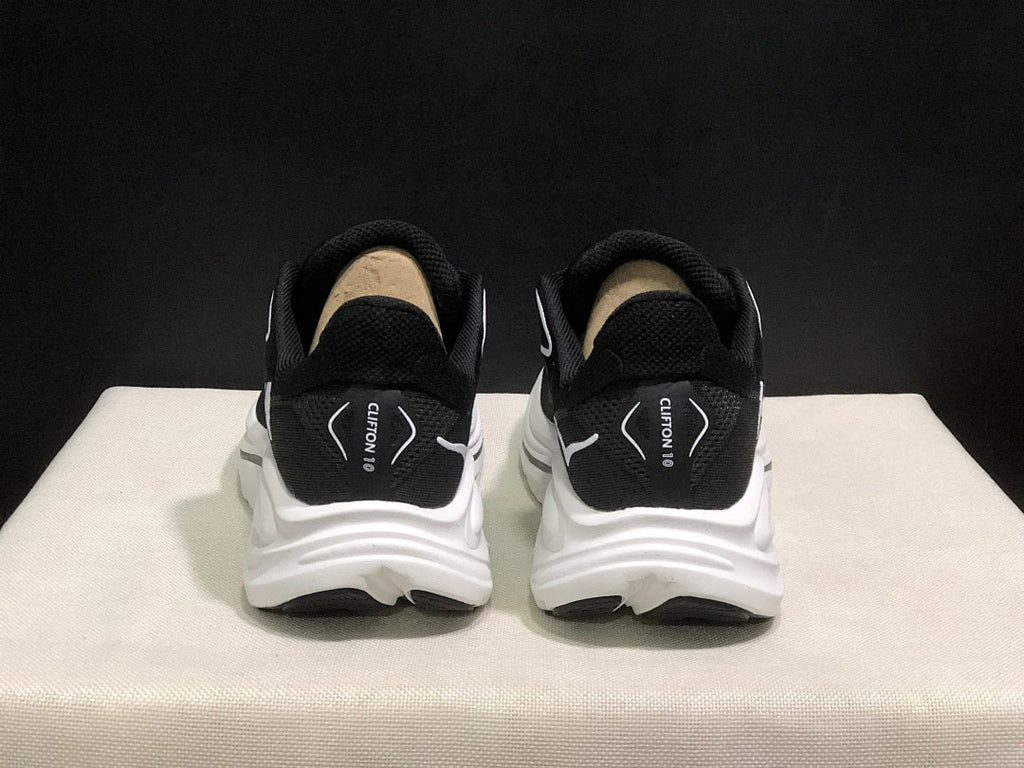 HOKA Clifton 10 Running Shoes in Black and White - product image from the listing.