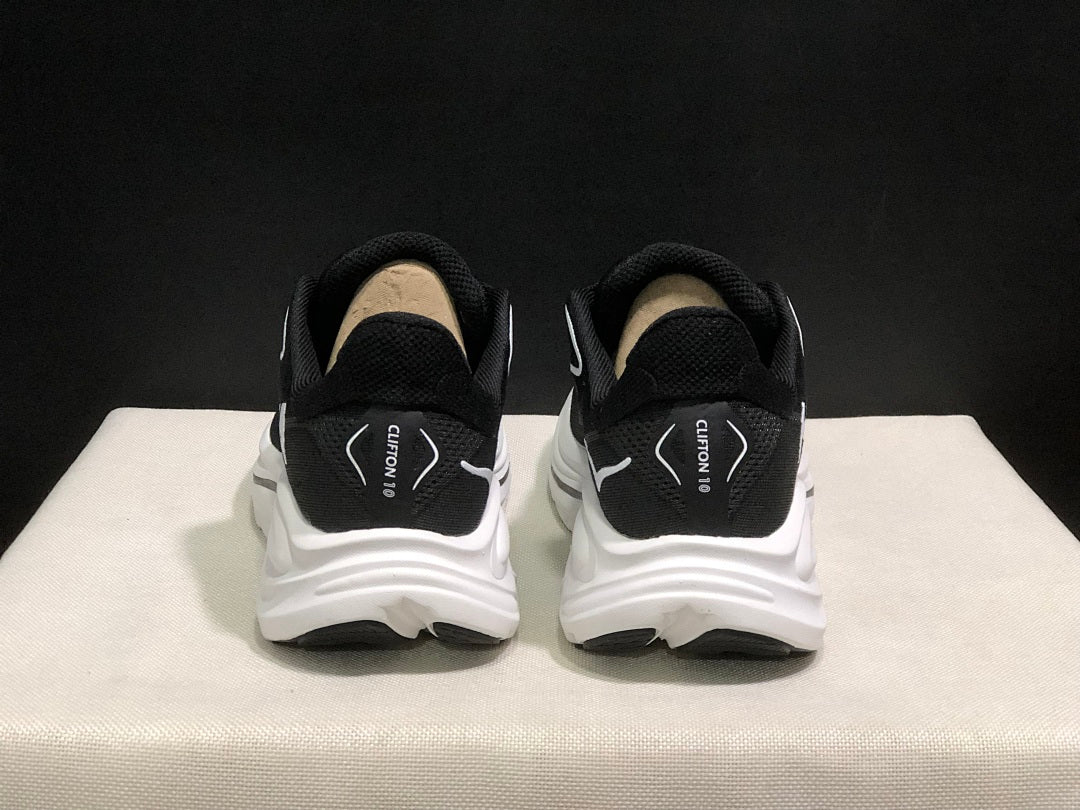 HOKA Clifton 10 Running Shoes in Black and White - product image from the listing.